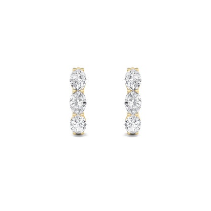 3CTW Oval Shaped Lab Grown Diamond (F/VS) Three Stone Huggie Earrings in 14K Gold